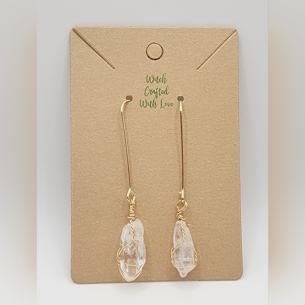 Gold plated drop earrings with wire wrapped quartz crystal.